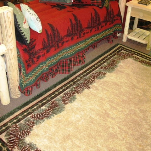 Bedroom scene with Pine Mountain floor rug Wooded river Red BEar Bedding.